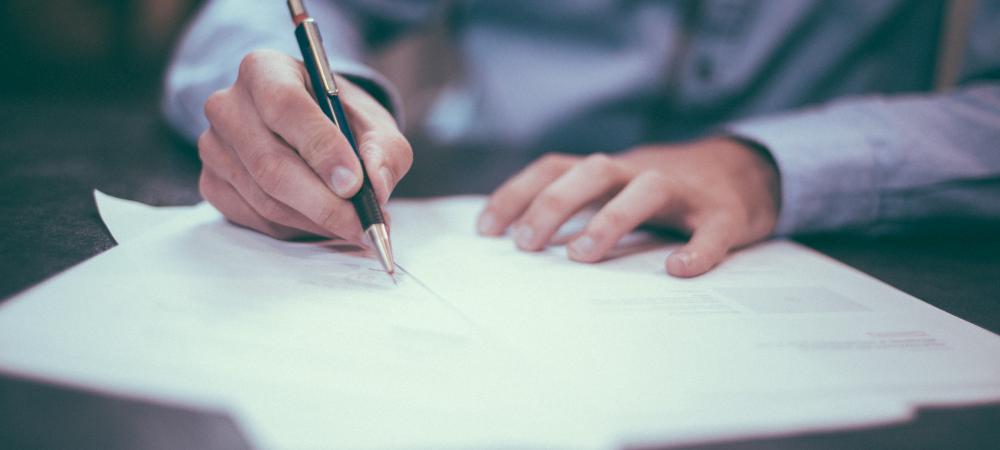 Man writing a document.